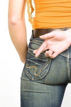 istock_000004882415xsmall-young-woman-with-fingers-crossed-behind-back.jpg